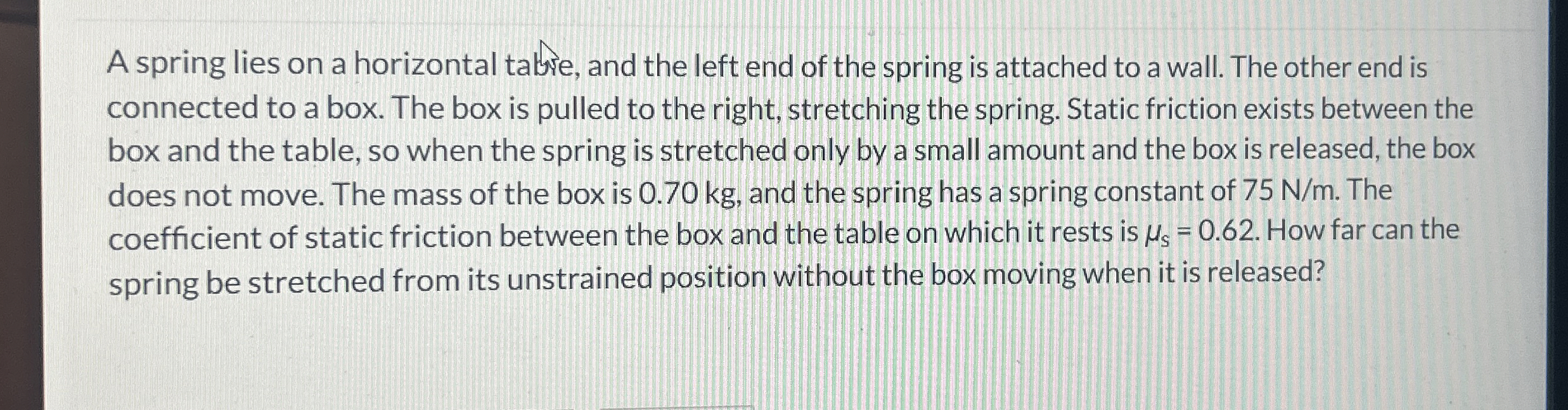 A spring lies on a horizontal tabre, and the left