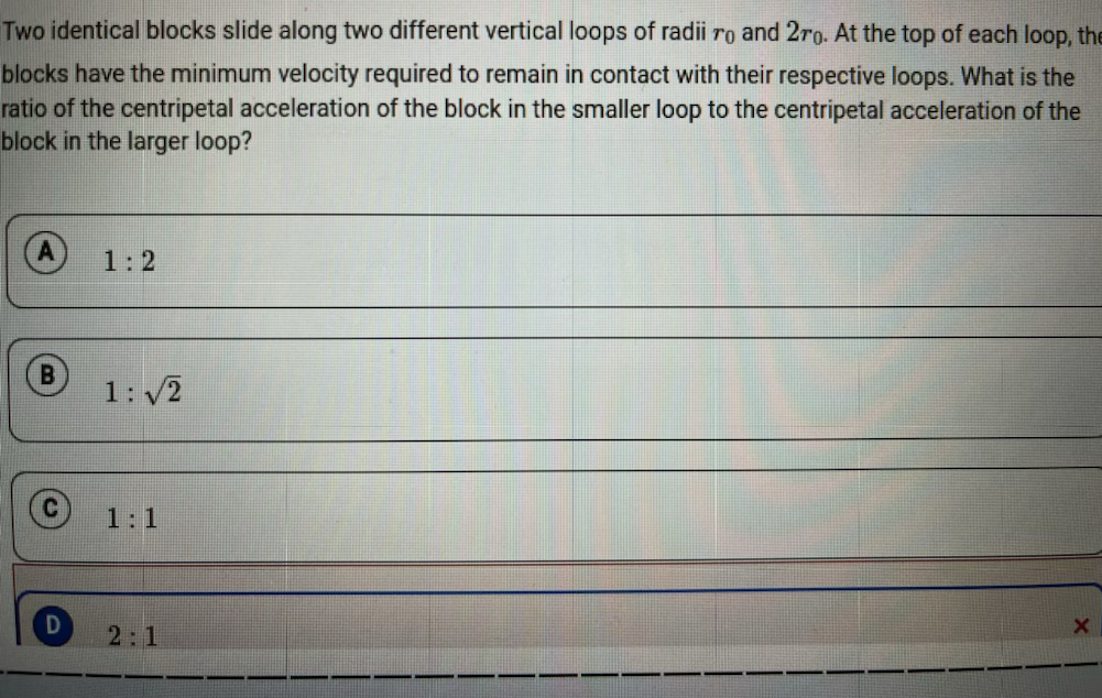 Two identical blocks slide along two different