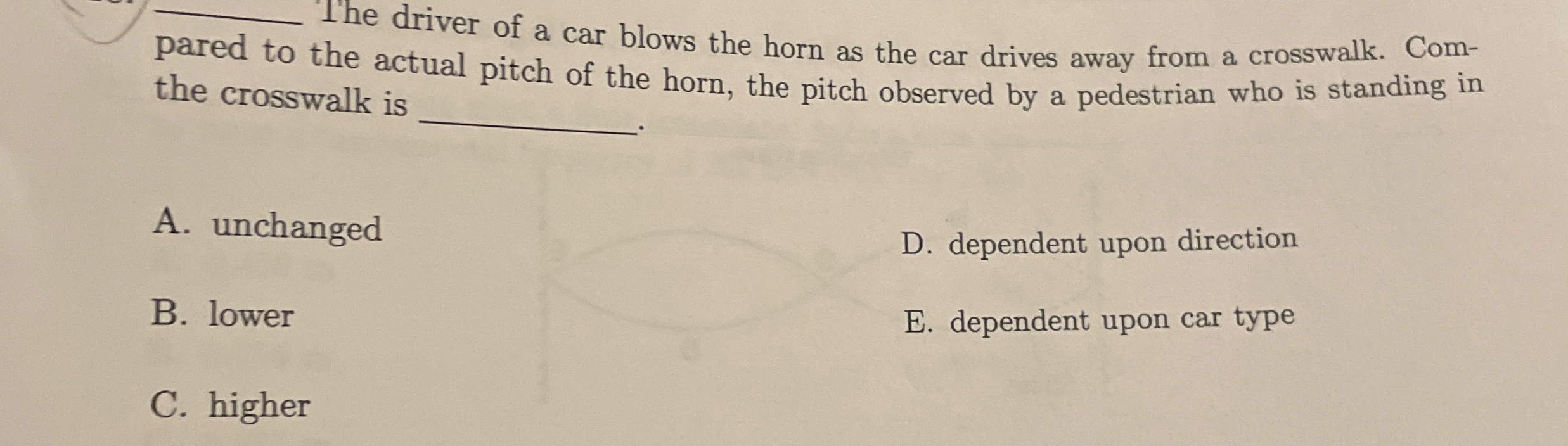 The driver of a car blows the horn as the car