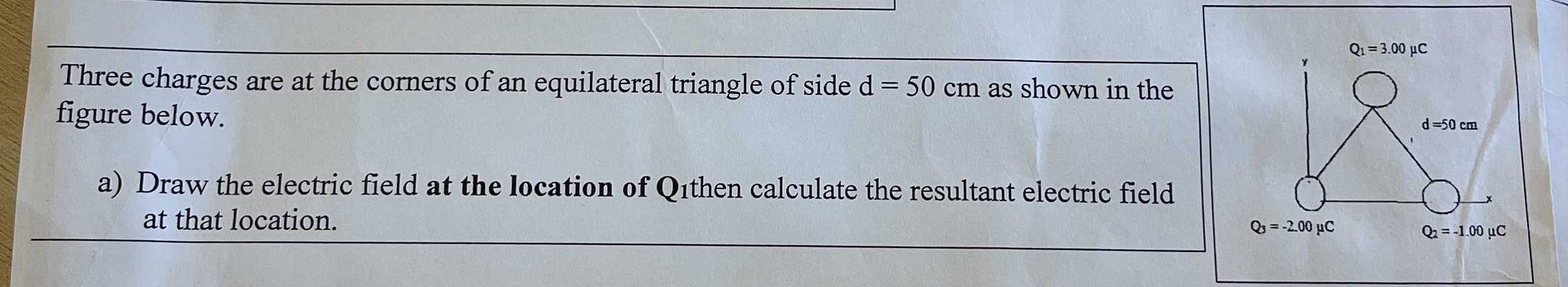 Three charges are at the corners of an