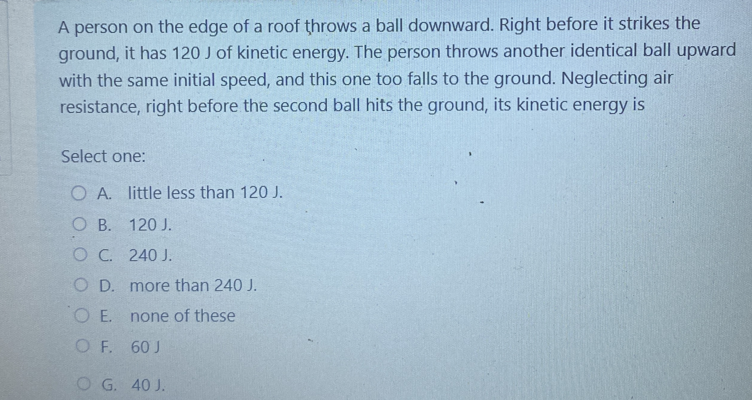 A person on the edge of a roof throws a ball