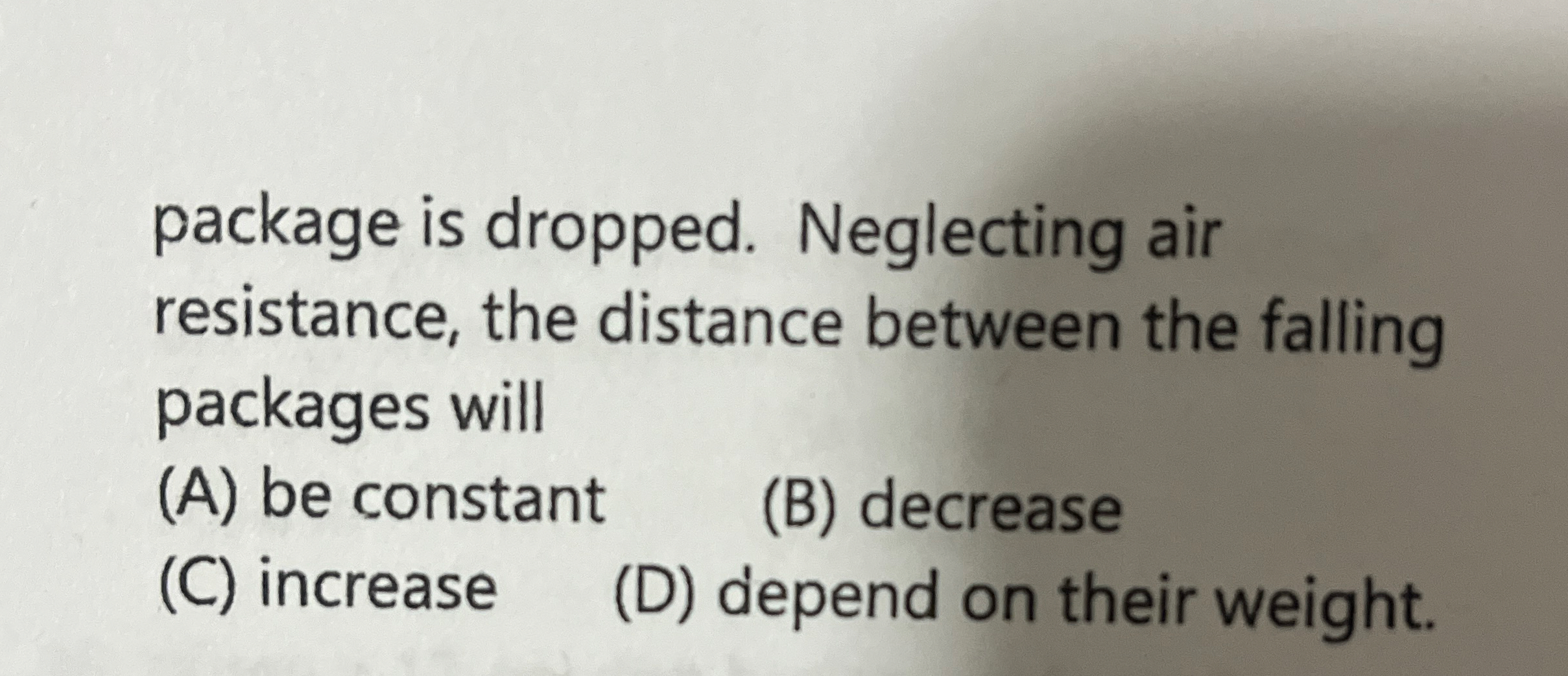 A package of supplies is dropped from a plane,