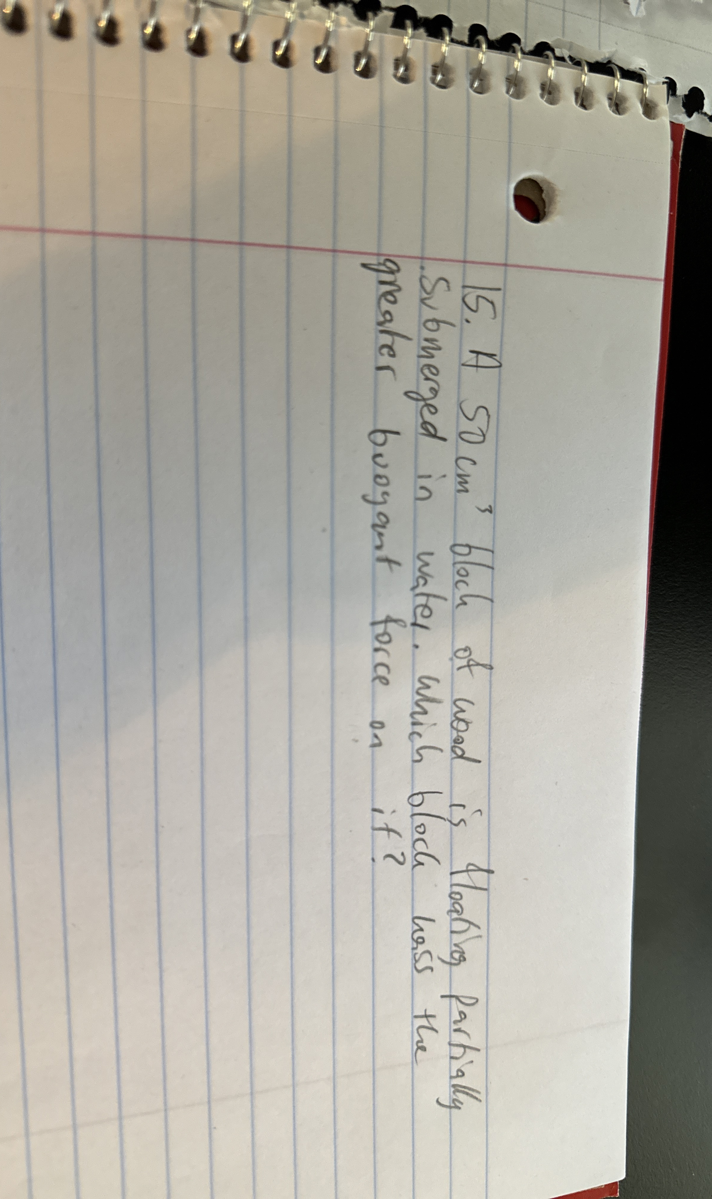 A 5 0 c m 3 bloch of wood is Hoating Partially