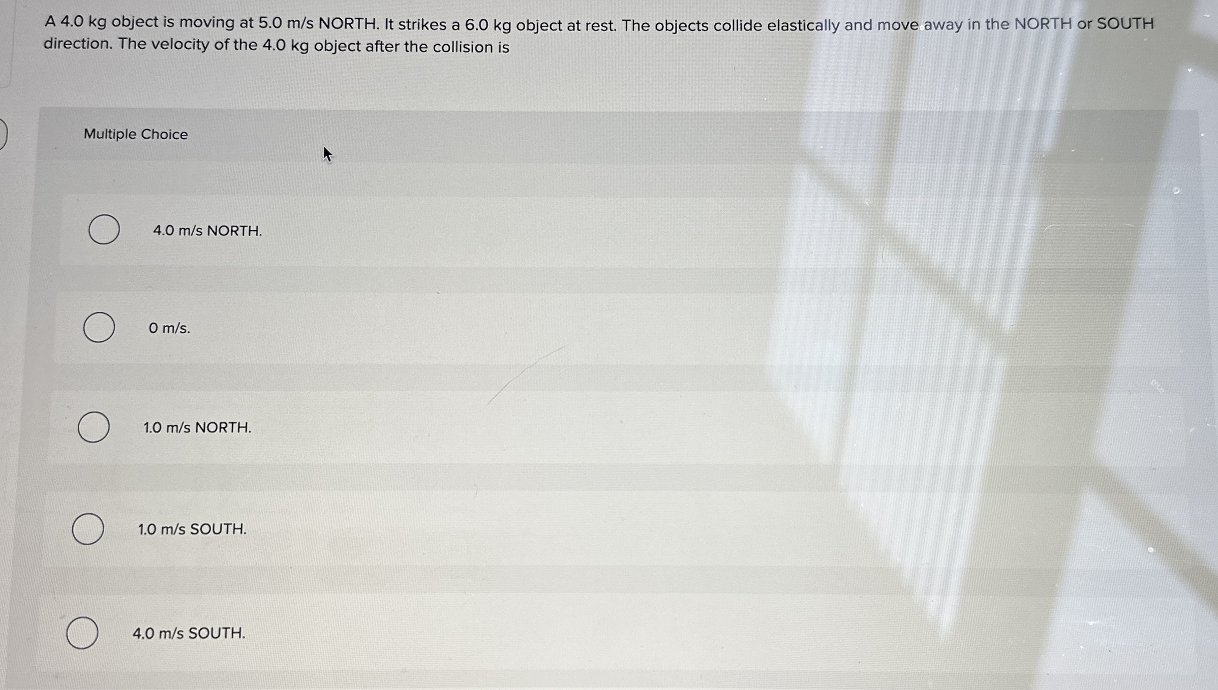 A 4 . 0 kg object is moving at 5 . 0 m s NORTH.