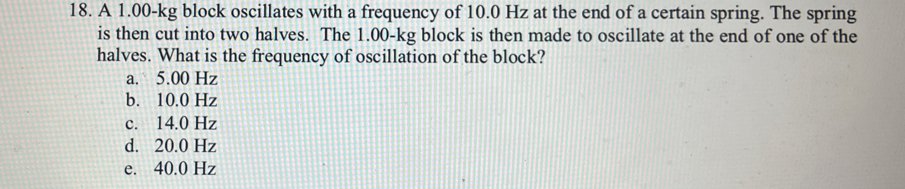 A 1 . 0 0 - k g block oscillates with a frequency