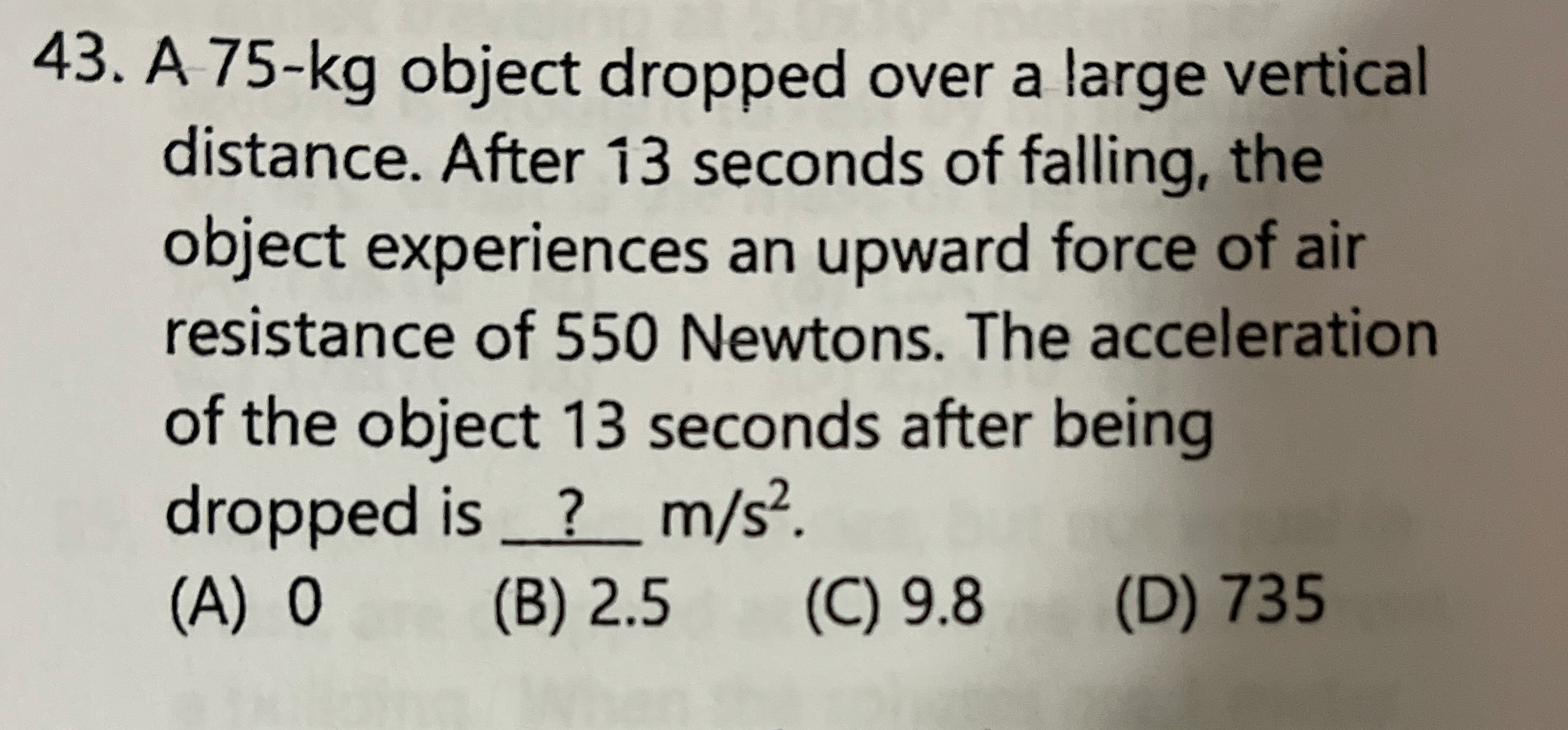 A 7 5 - k g object dropped over a large vertical