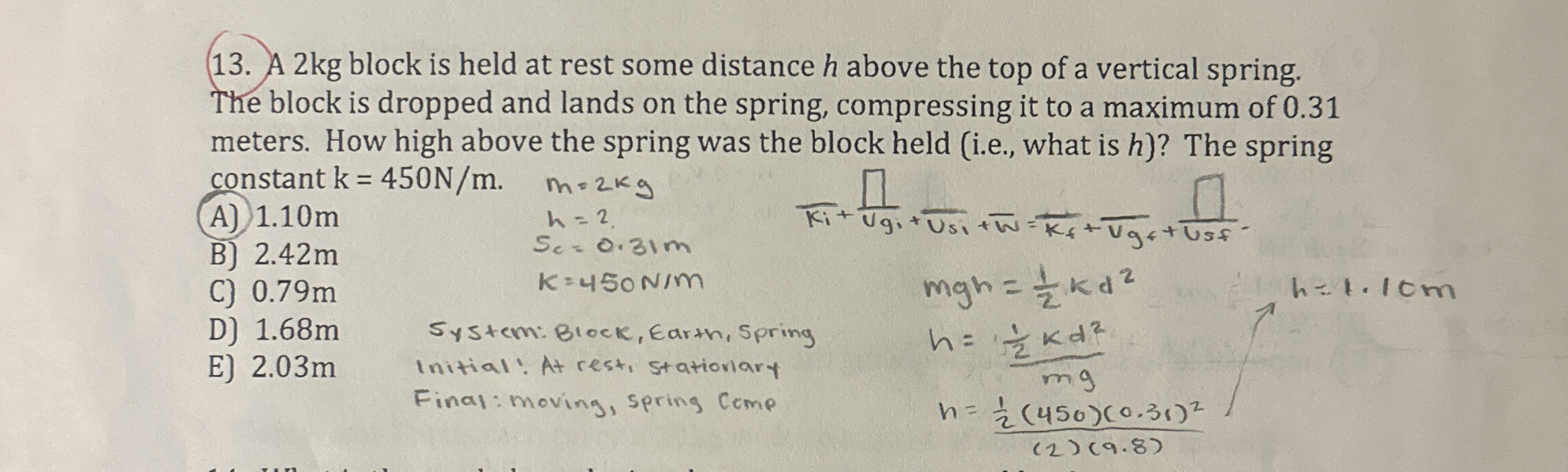 A 2 kg block is held at rest some distance h