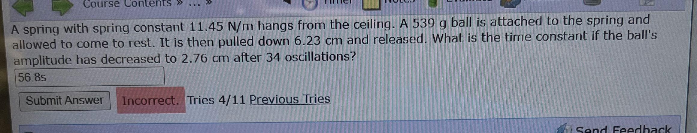 A spring with spring constant 1 1 . 4 5 N m hangs