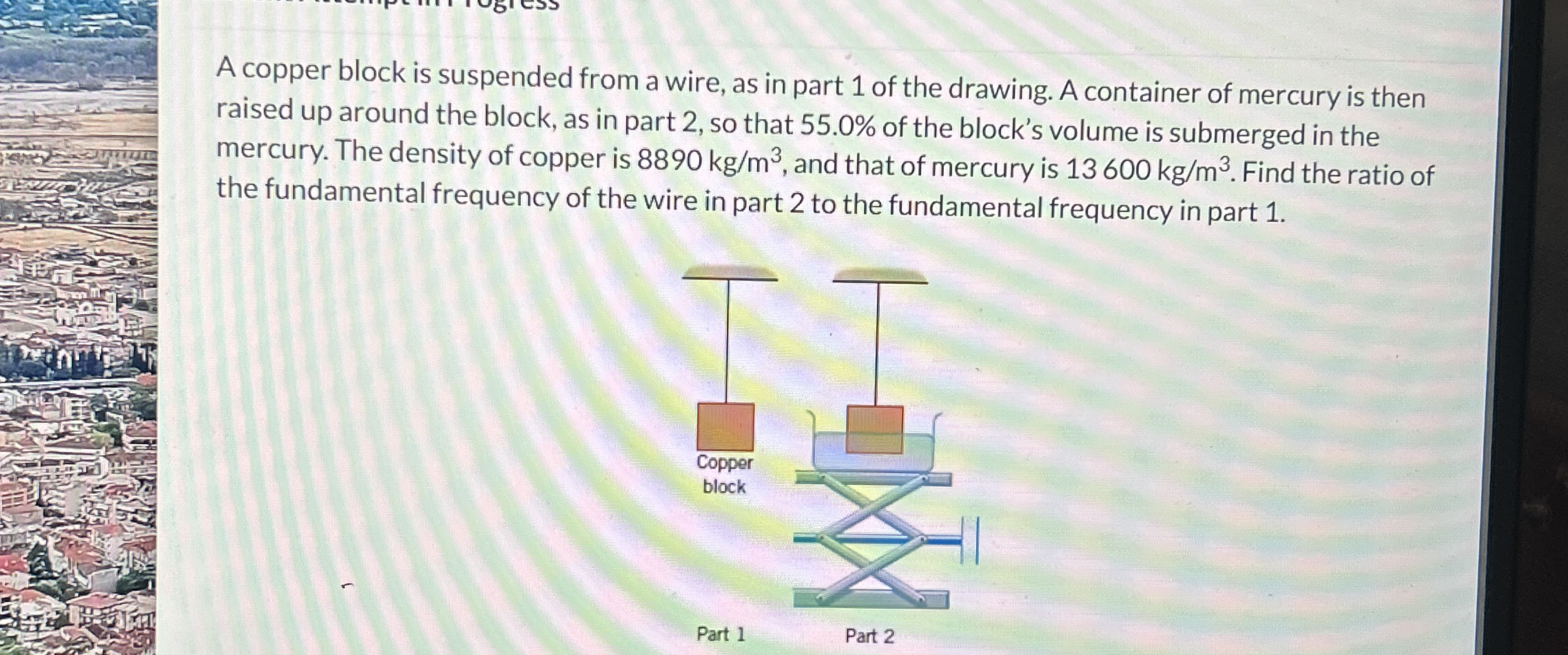 A copper block is suspended from a wire, as in