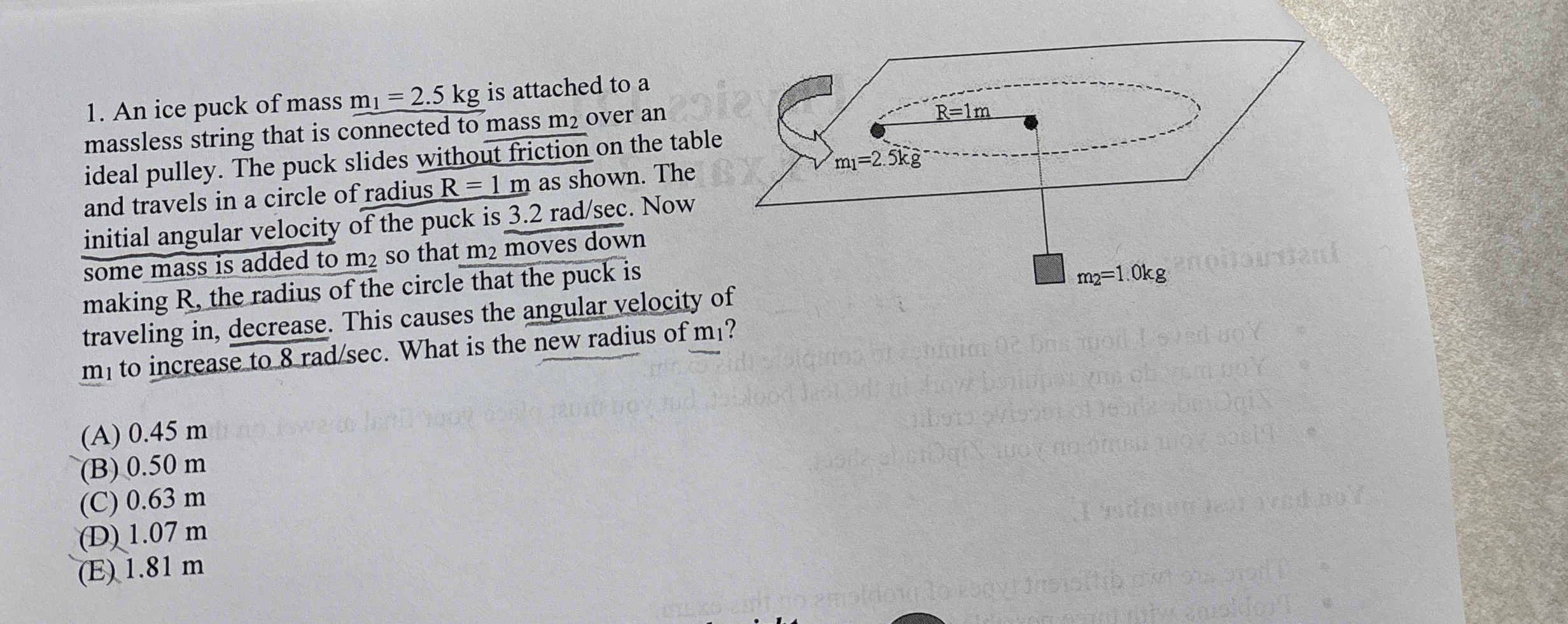 An ice puck of mass m 1 = 2 . 5 k g is attached