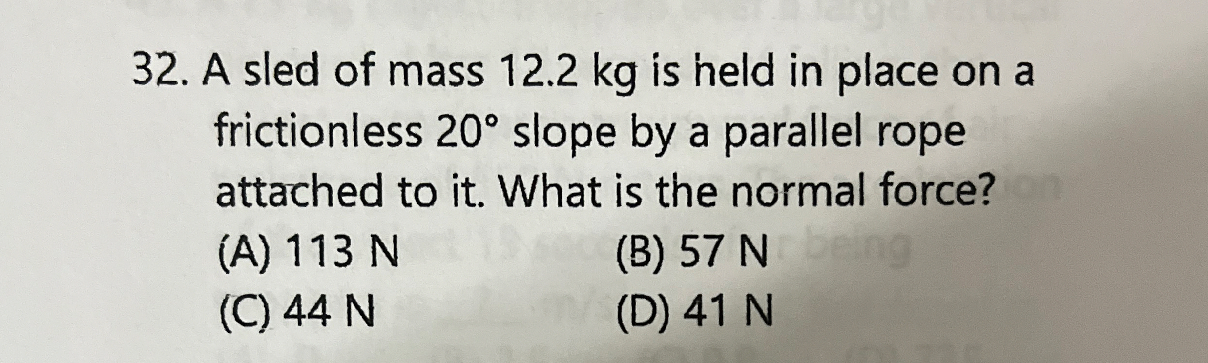 A sled of mass 1 2 . 2 kg is held in place on a