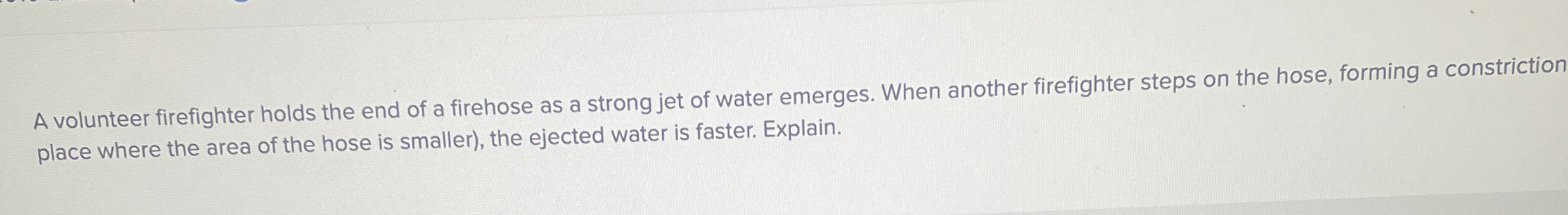 A volunteer firefighter holds the end of a