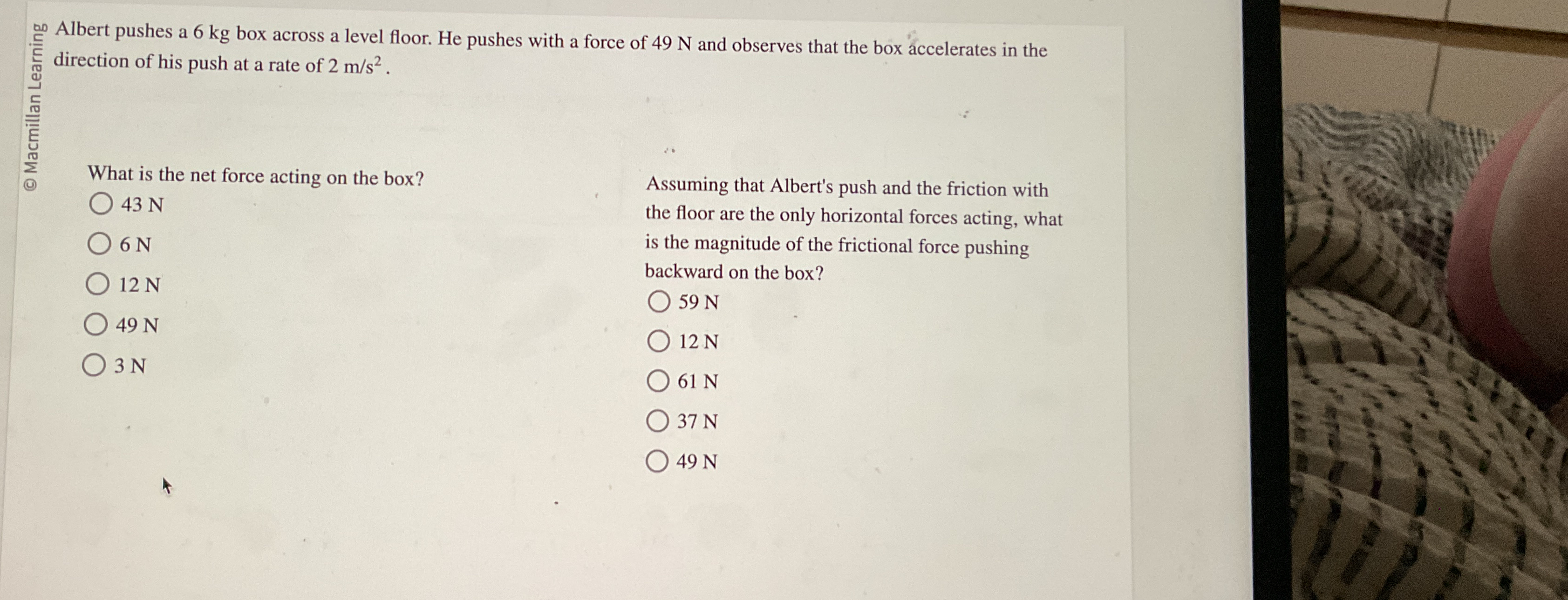 Albert pushes a 6 kg box across a level floor. He