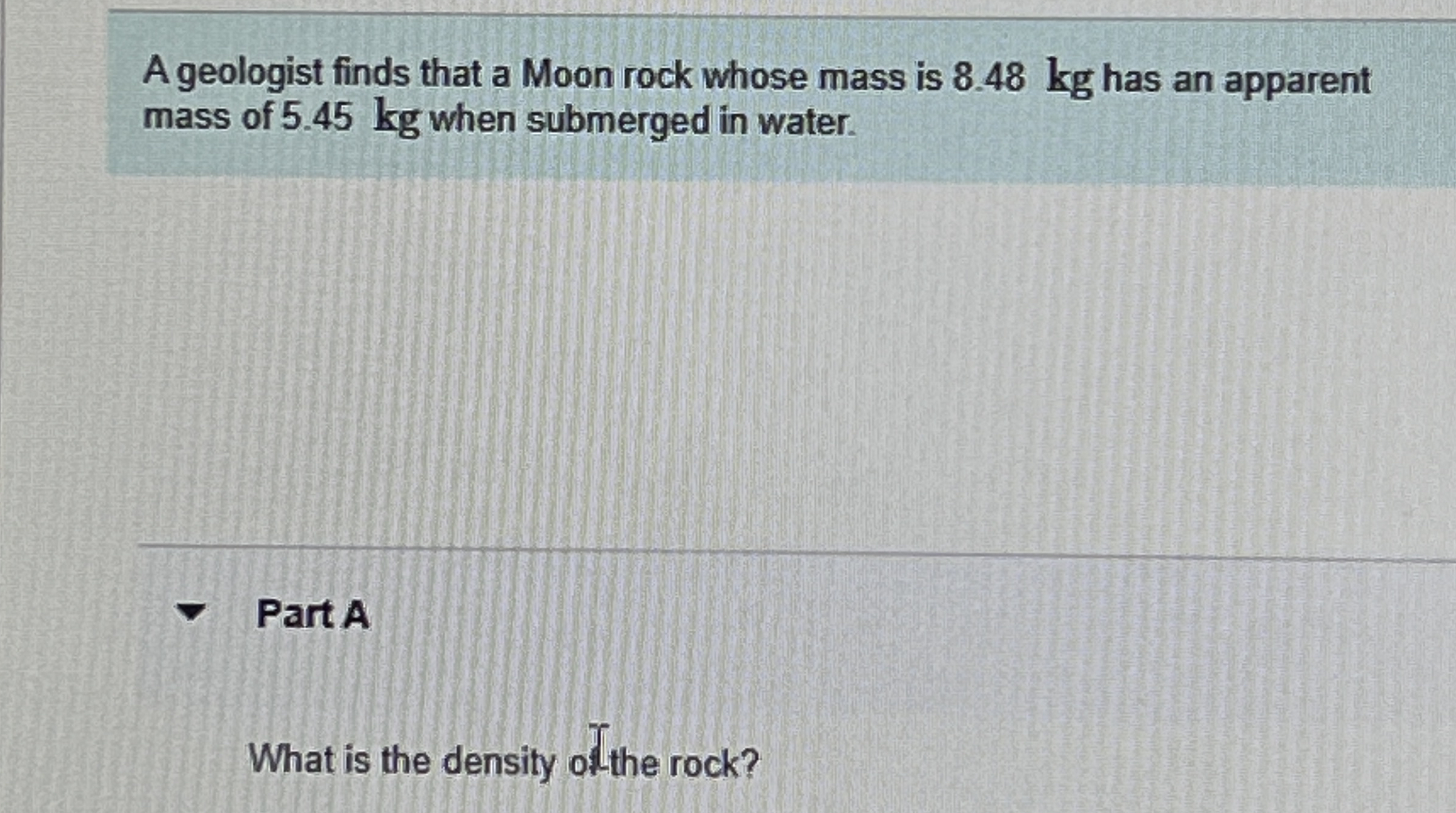 A geologist finds that a Moon rock whose mass is