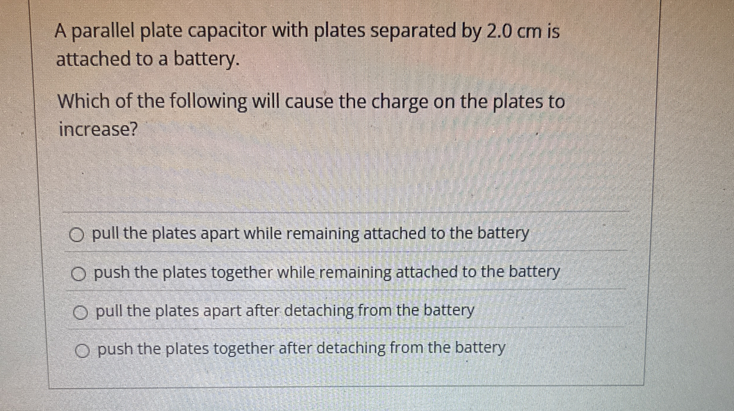A parallel plate capacitor with plates separated
