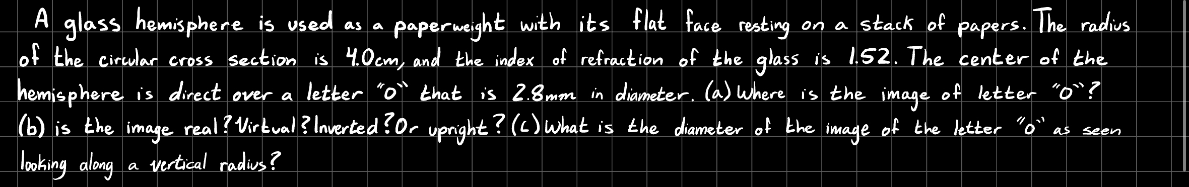 A glass hemisphere is used as a paperweight with