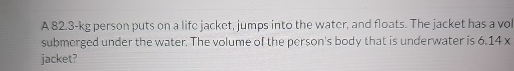 A 8 2 . 3 - kg person puts on a life jacket,