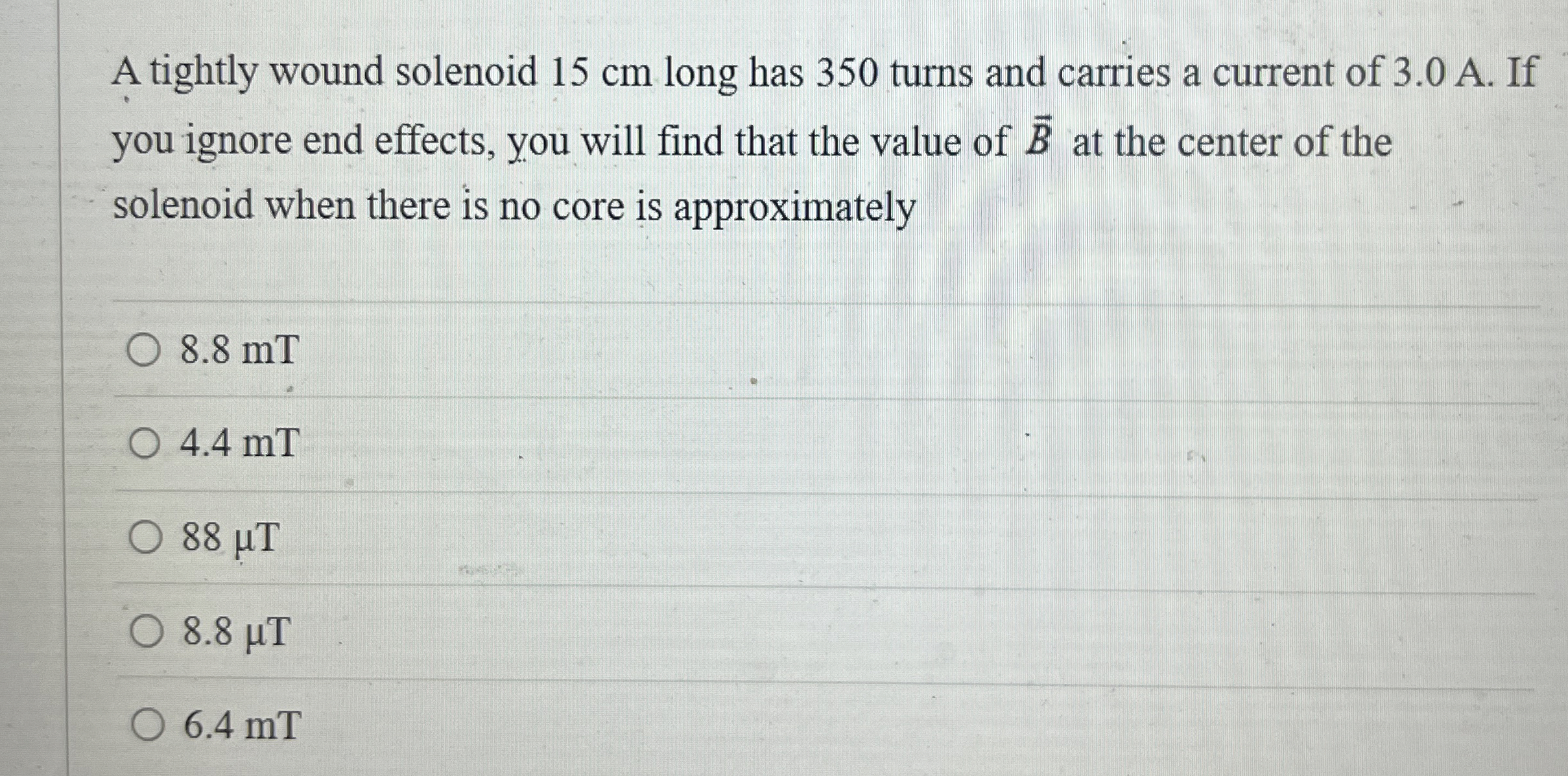 A tightly wound solenoid 1 5 cm long has 3 5 0