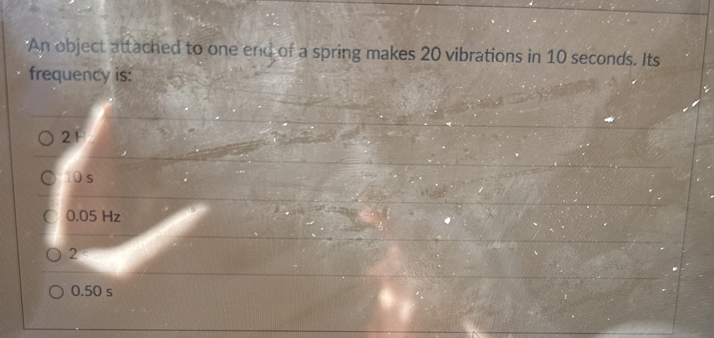 An object attached to one entiof a spring makes 2