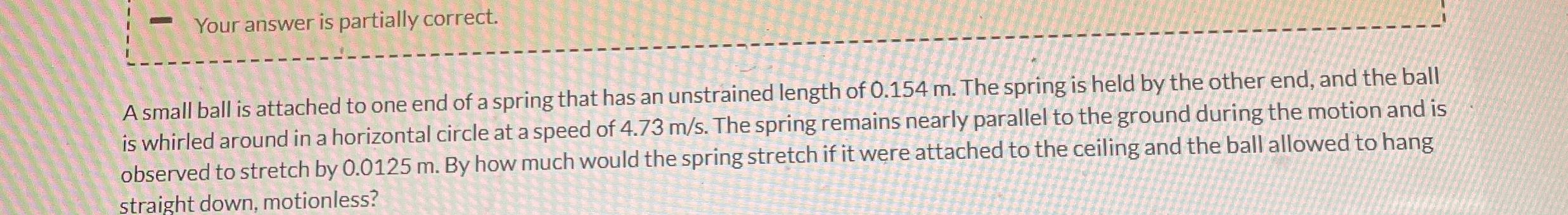 A small ball is attached to one end of a spring