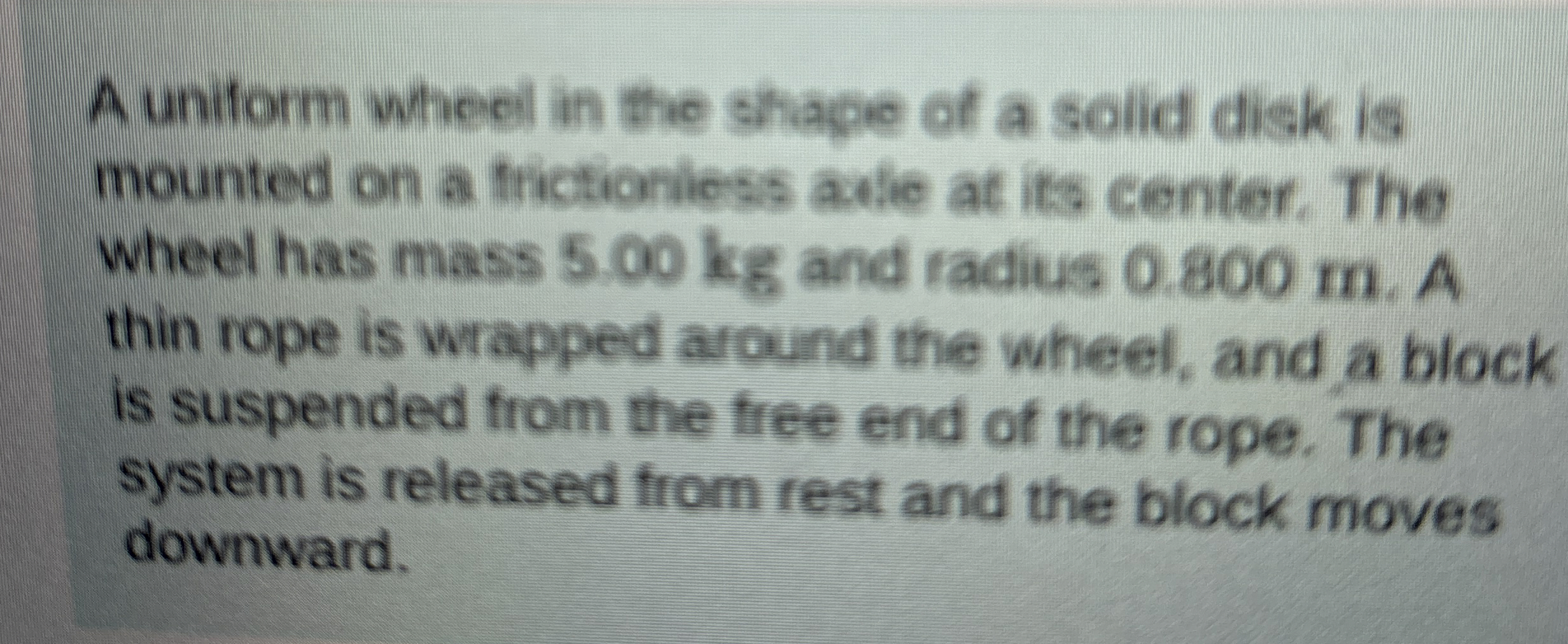 A uniform wheel in the shape of a solid disk is