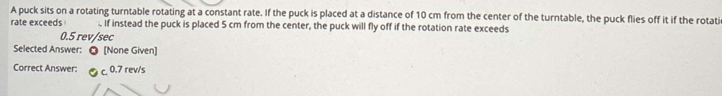A puck sits on a rotating turntable rotating at a