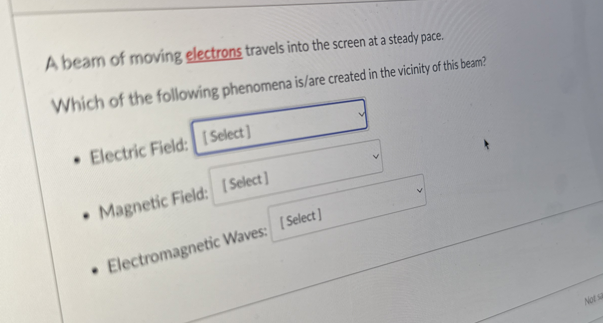 A beam of moving electrons travels into the