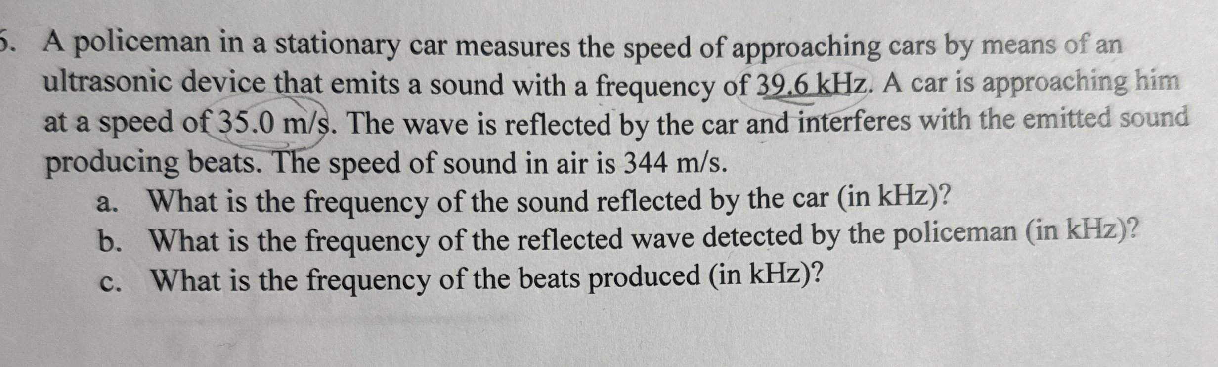 A policeman in a stationary car measures the