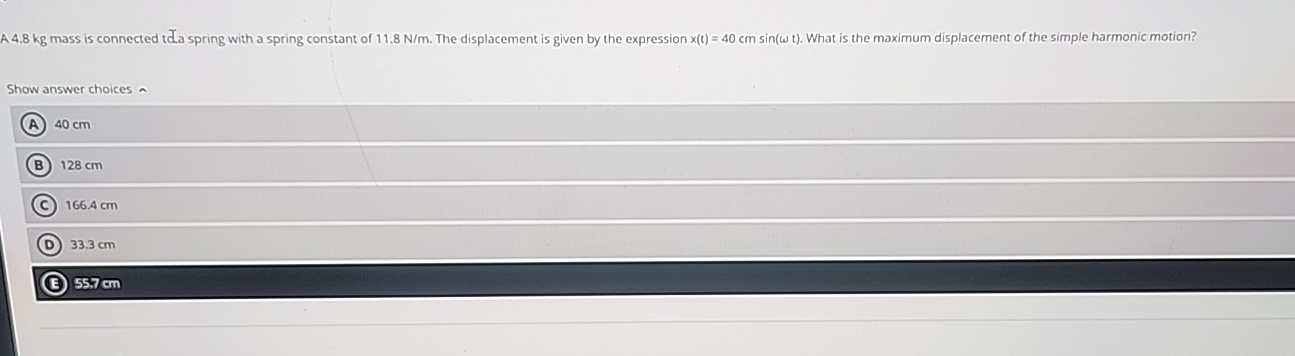 A 4 . 8 kg mass is connected tda spring with a