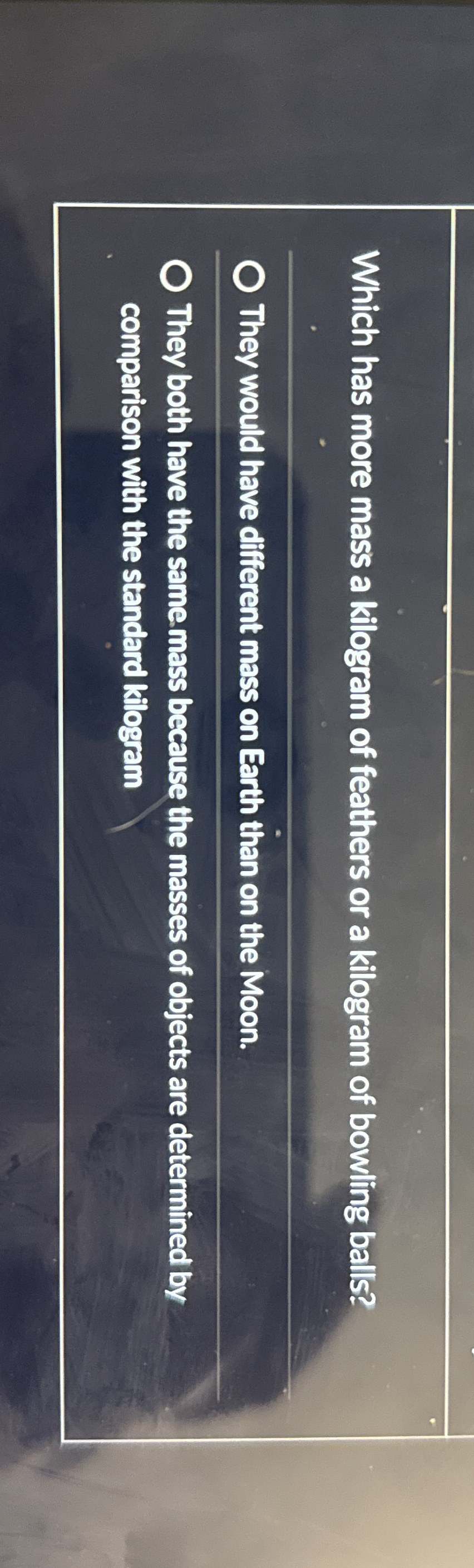 Which has more mass a kilogram of feathers or a