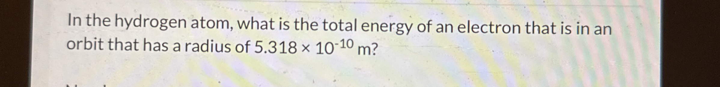 In the hydrogen atom, what is the total energy of