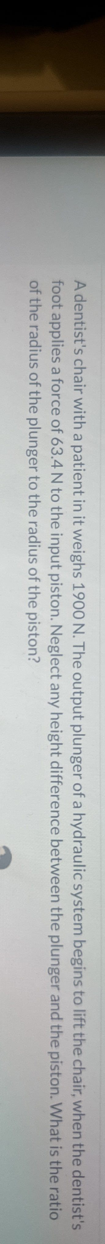 A dentist's chair with a patient in it weighs 1 9