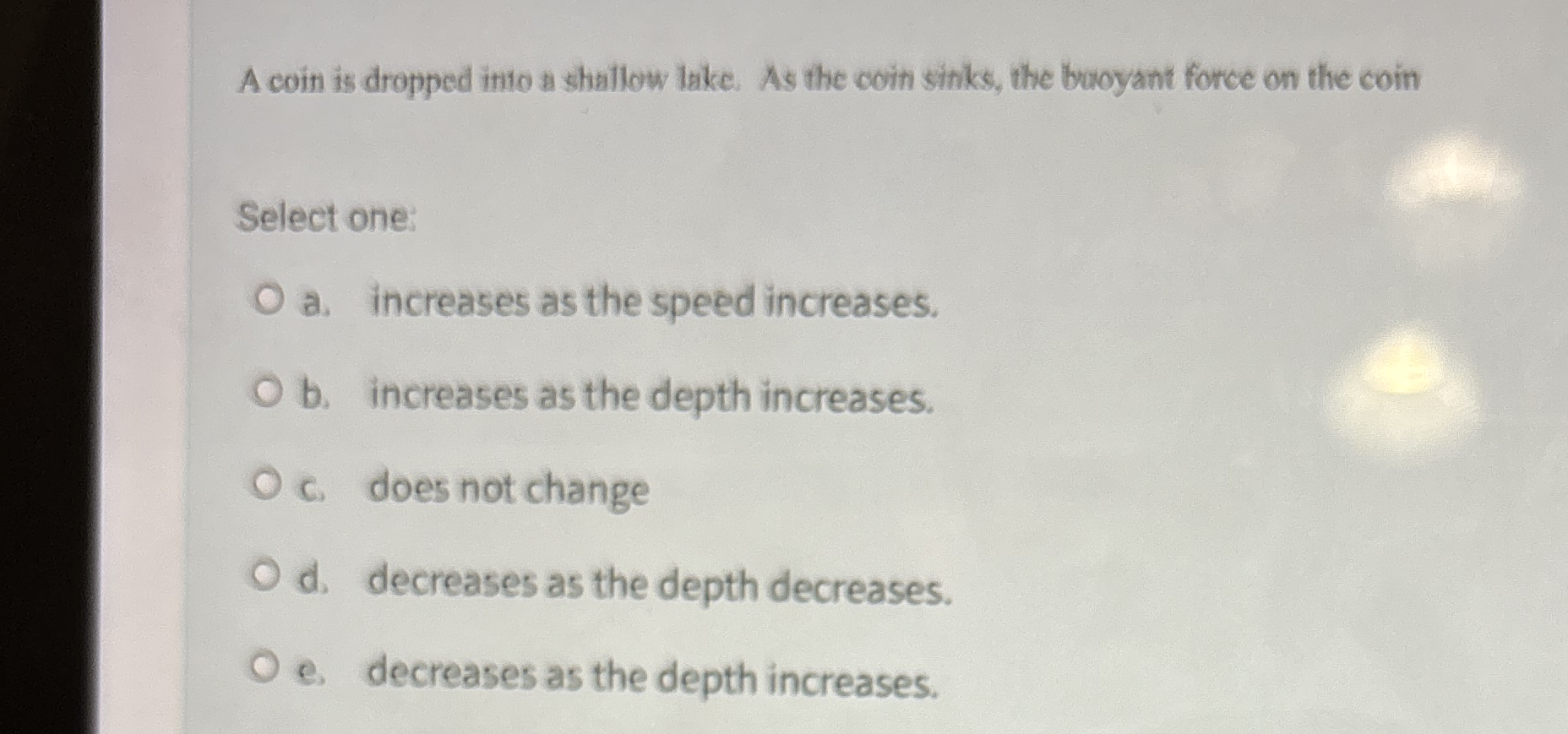 A coin is dropped into a shallow lake. As the