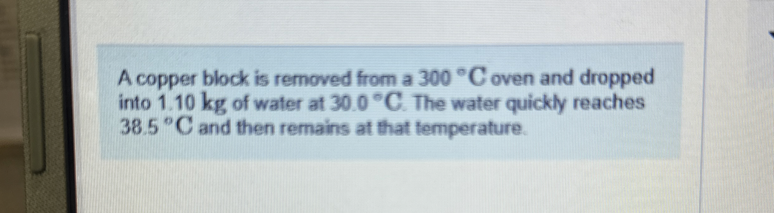 A copper block is removed from a 3 0 0 C oven and