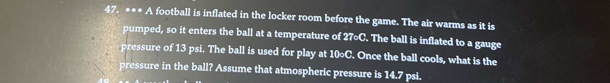 A football is inflated in the locker room before