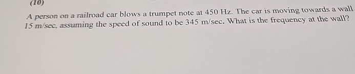 A person on a railroad car blows a trumpet note