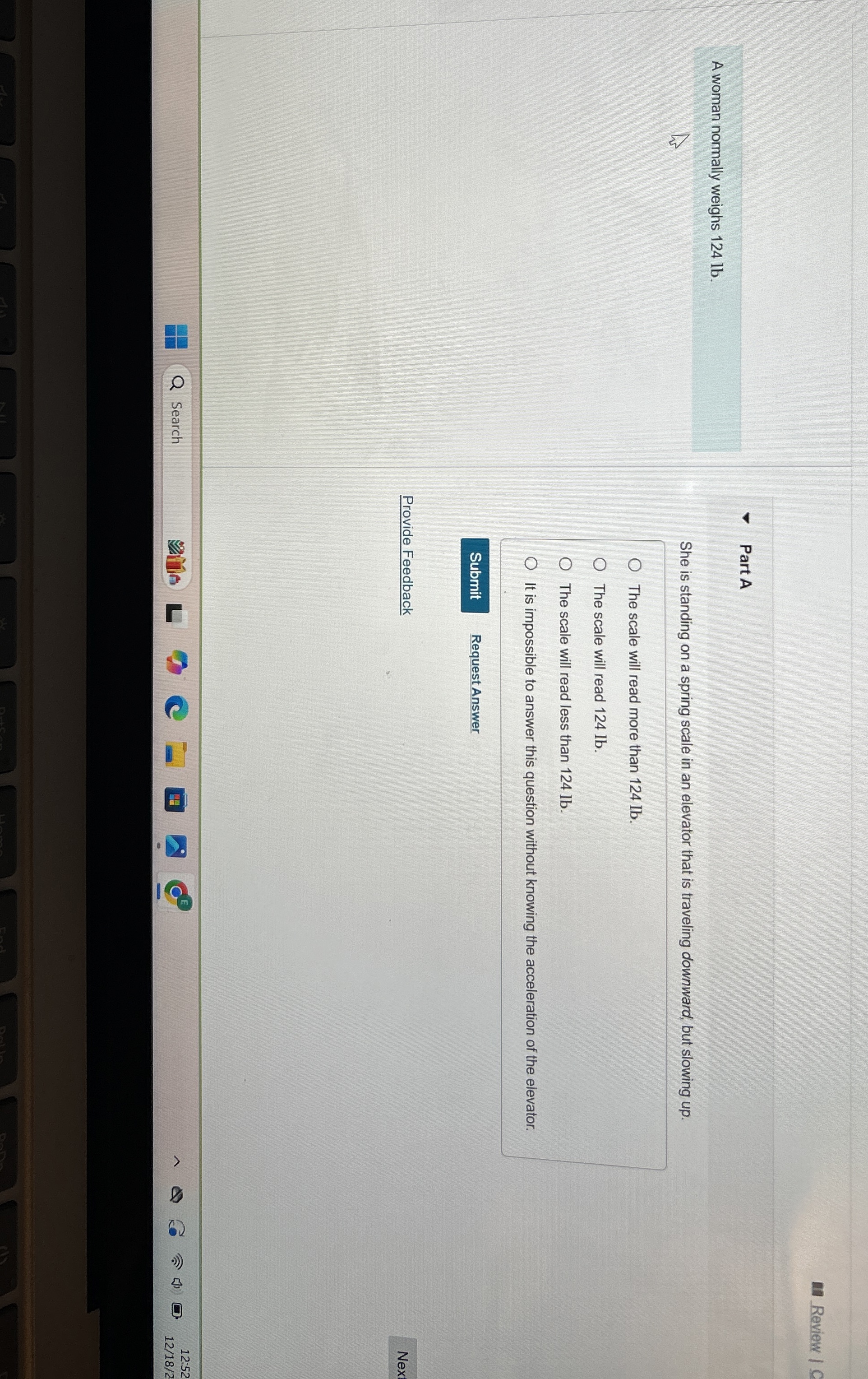 Review Part A She is standing on a spring scale