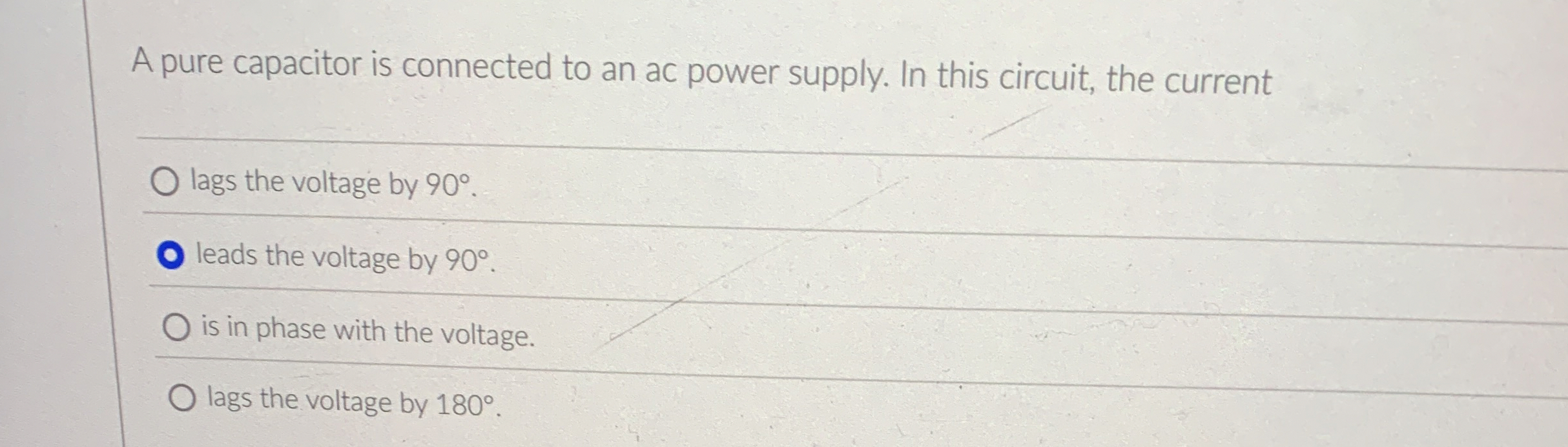 A pure capacitor is connected to an ac power