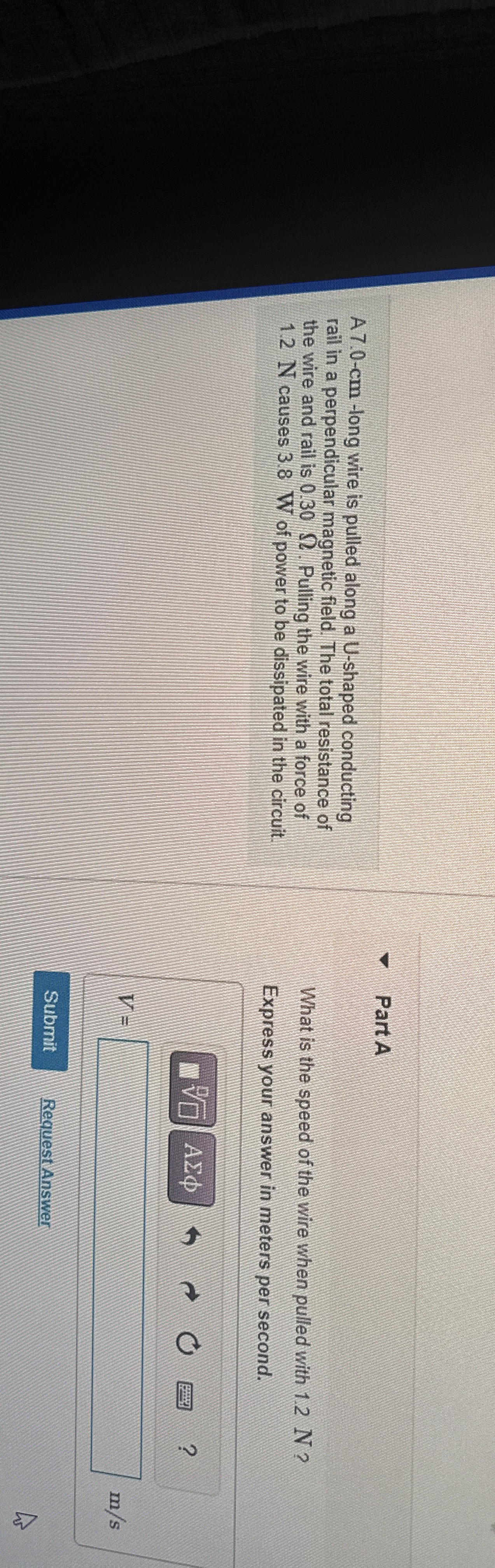 A 7 . 0 - c m - long wire is pulled along a U -