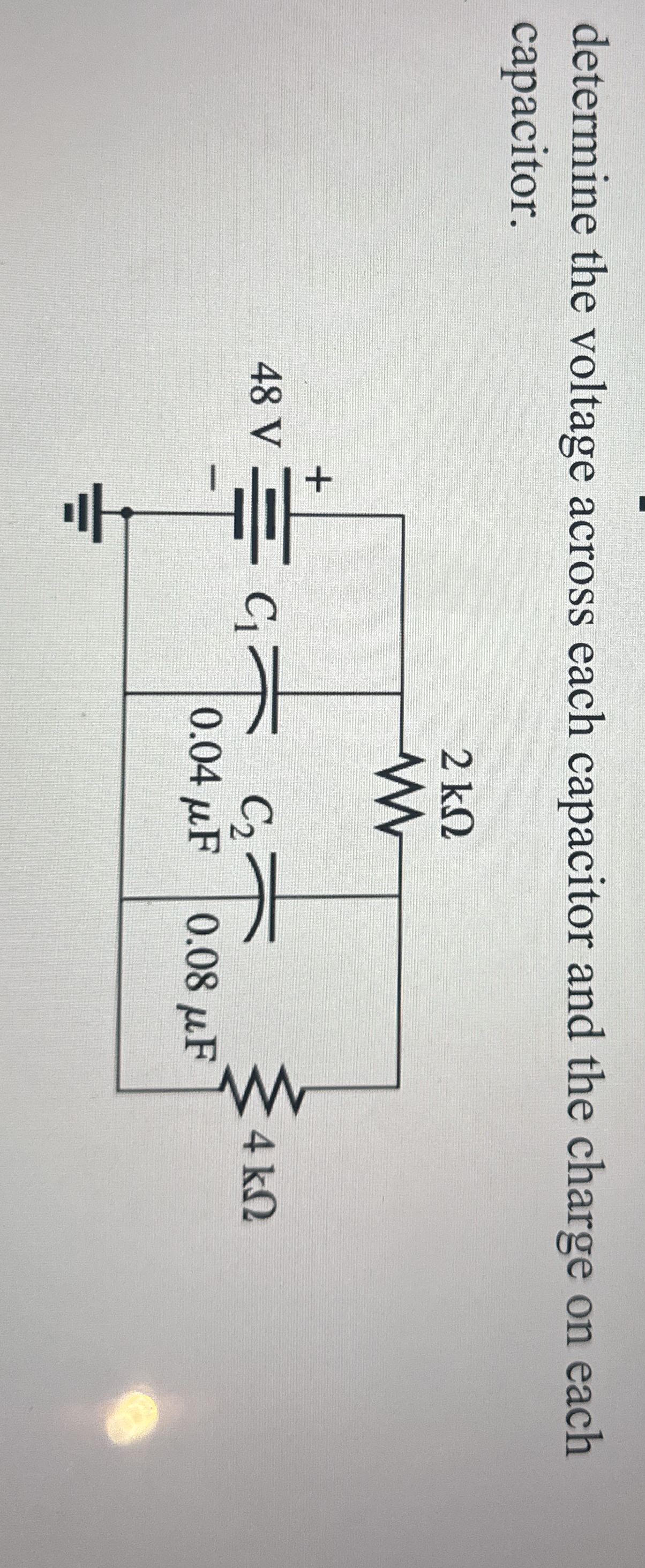 determine the voltage across each capacitor and