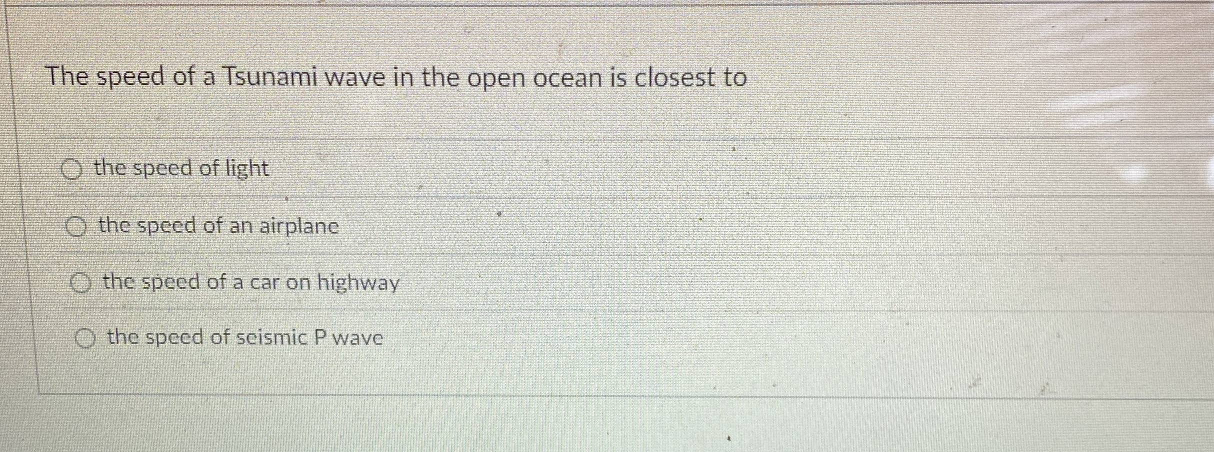 The speed of a Tsunami wave in the open ocean is