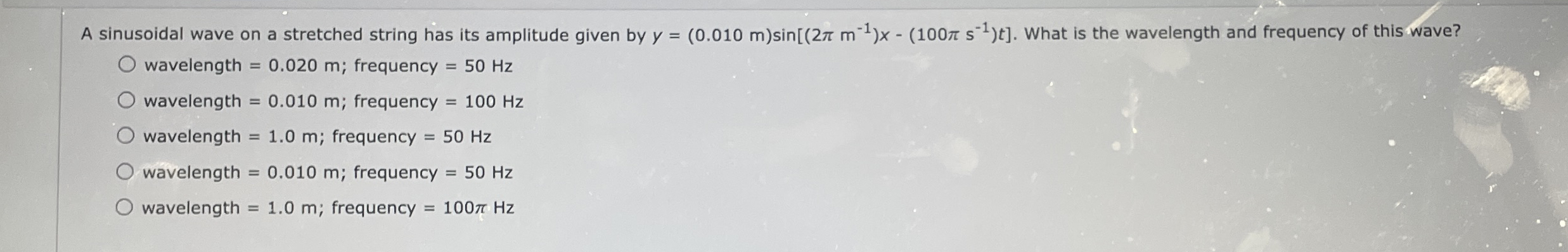 A sinusoidal wave on a stretched string has its