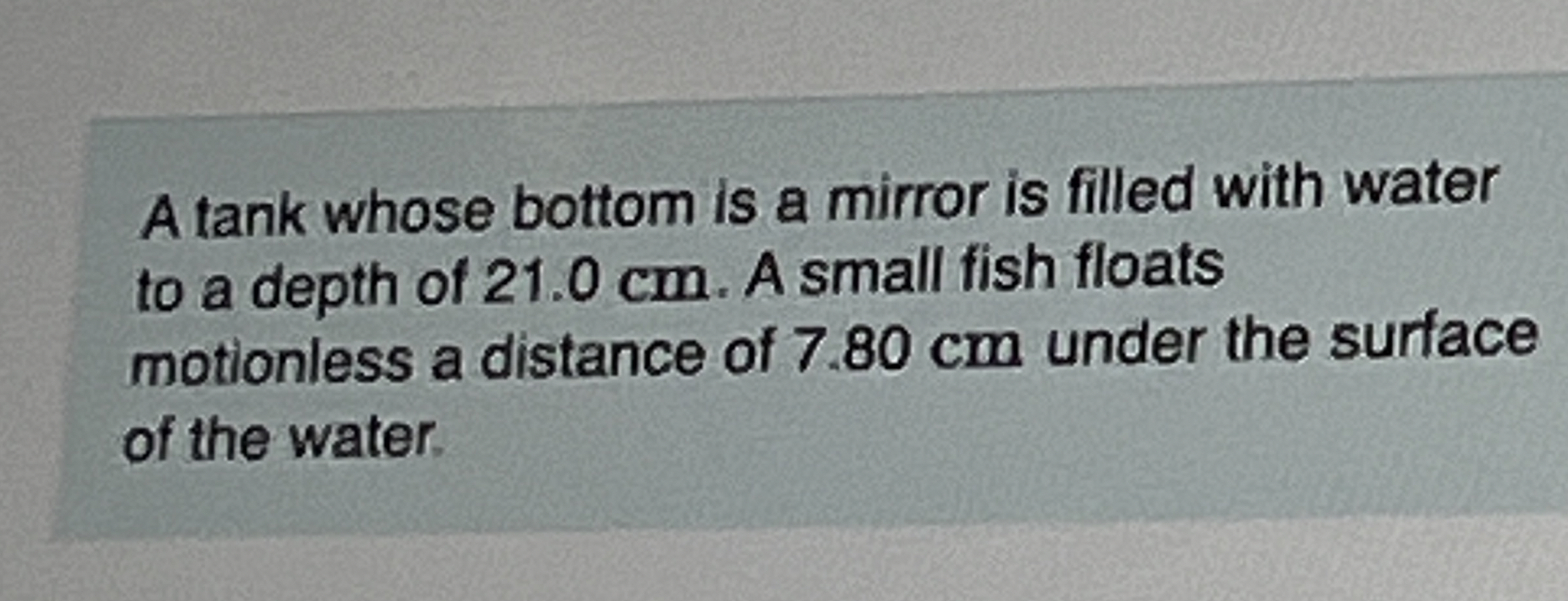 A tank whose bottom is a mirror is filled with