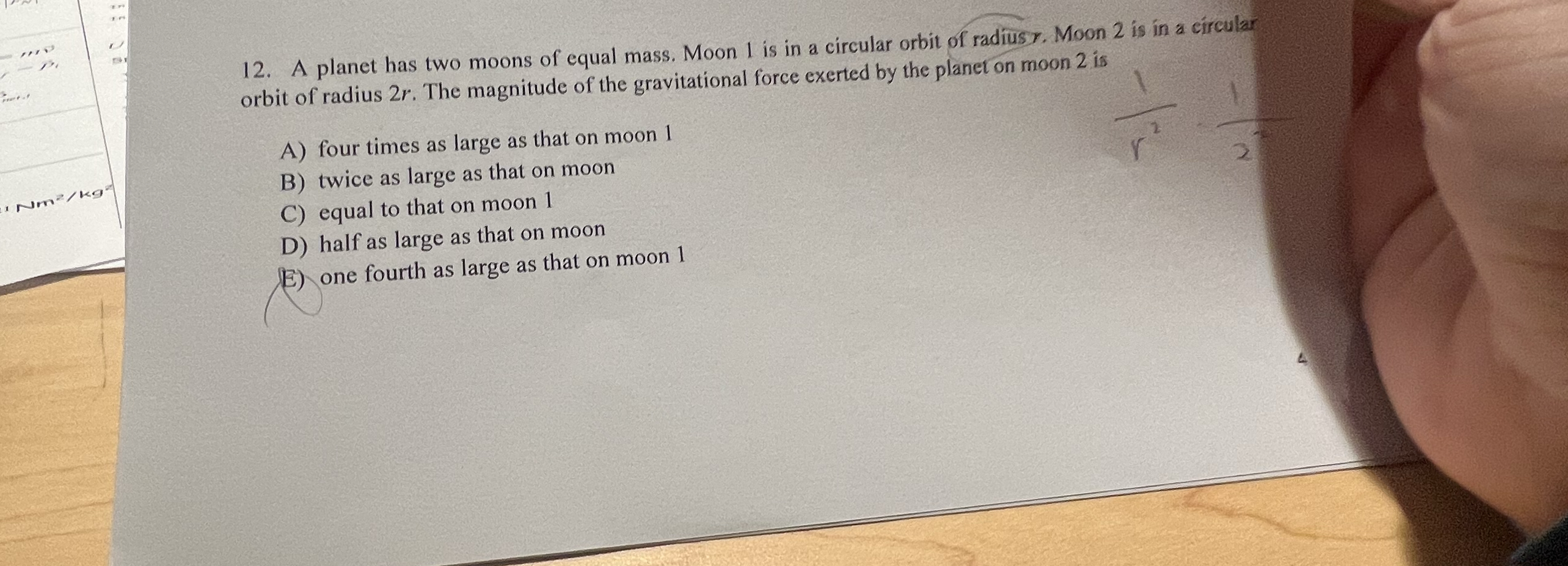 A planet has two moons of equal mass. Moon 1 is