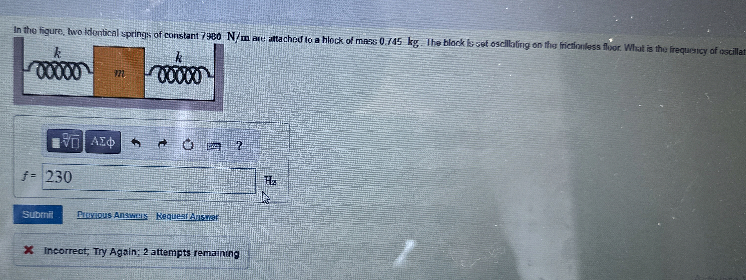 In the figure, two identical springs of constant