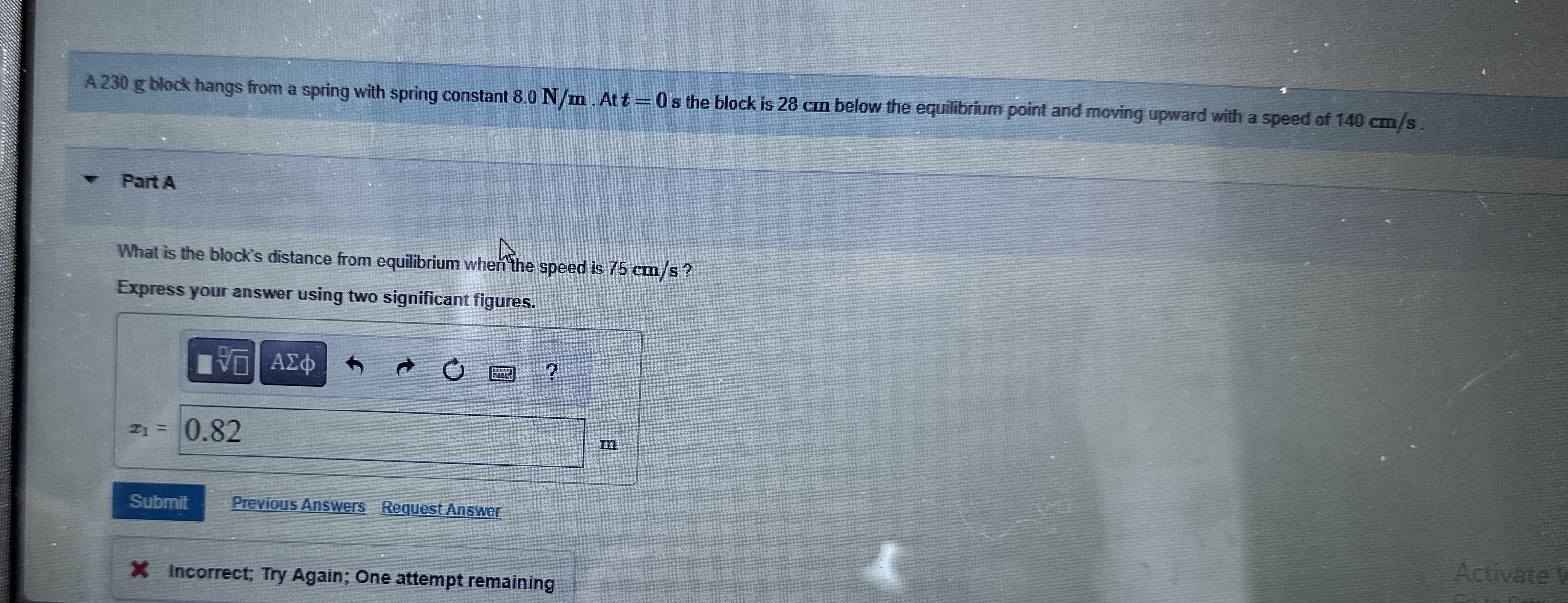 A 2 3 0 g block hangs from a spring with spring