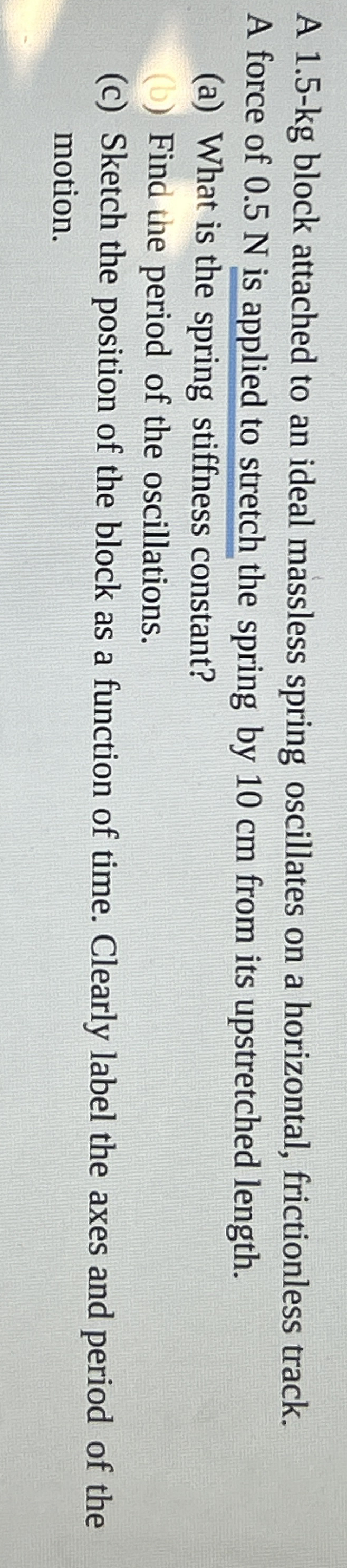 A 1 . 5 - kg block attached to an ideal massless