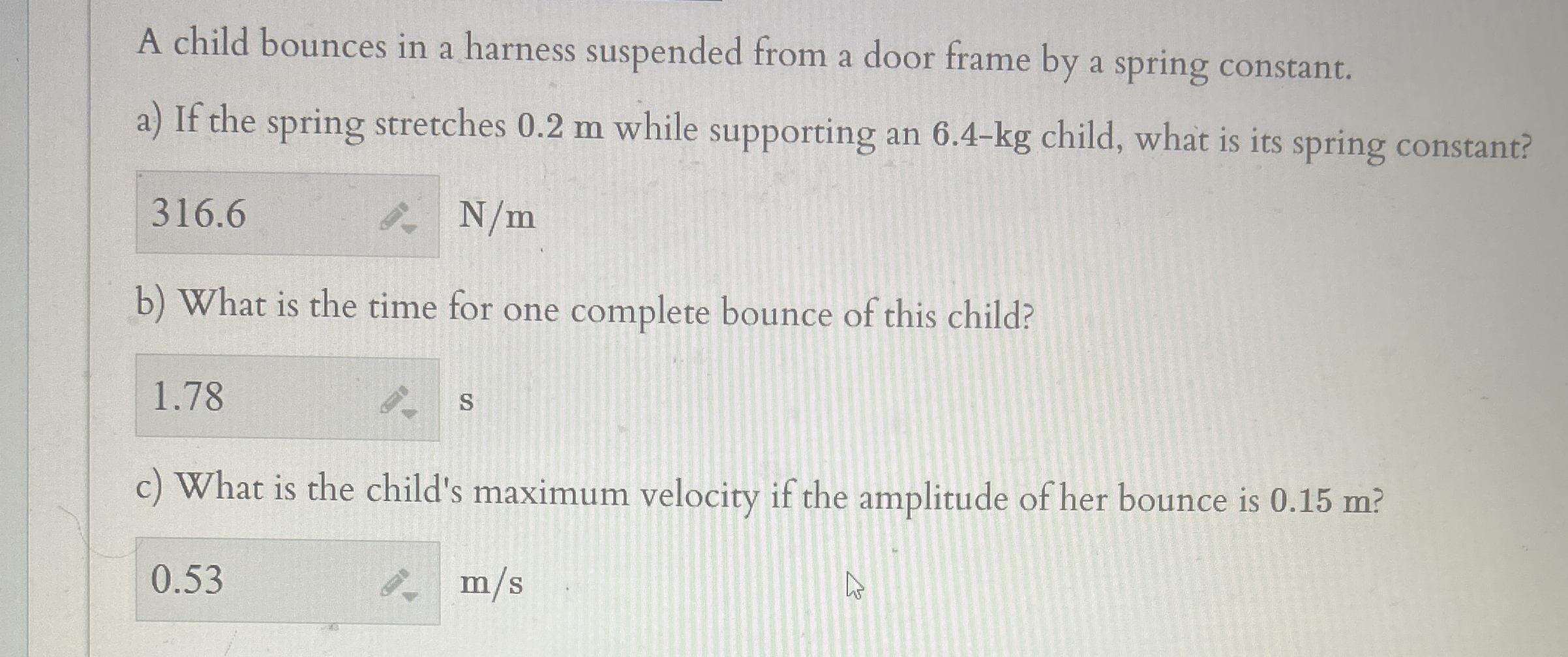 A child bounces in a harness suspended from a