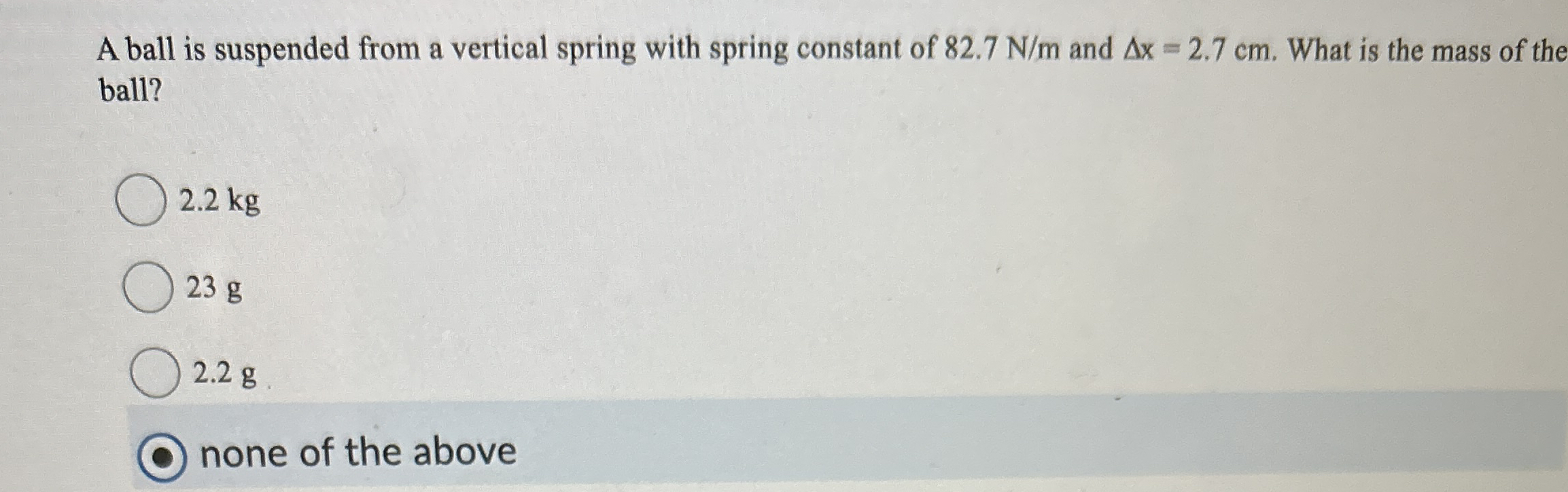A ball is suspended from a vertical spring with