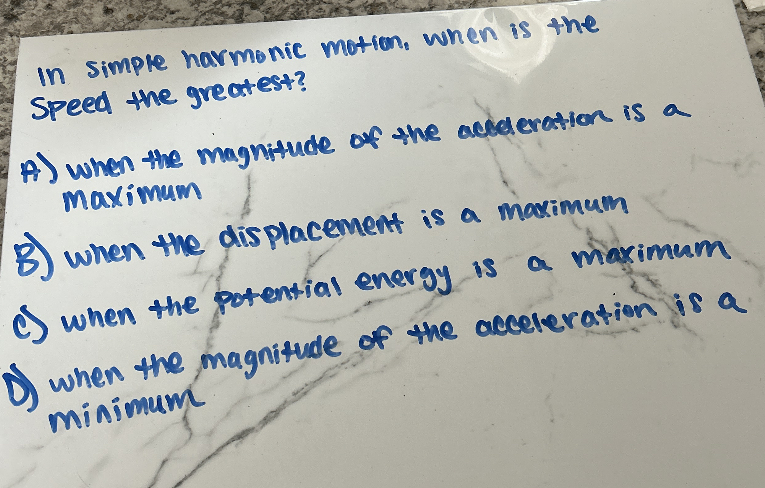 In simple harmonic motion, when is the speed the